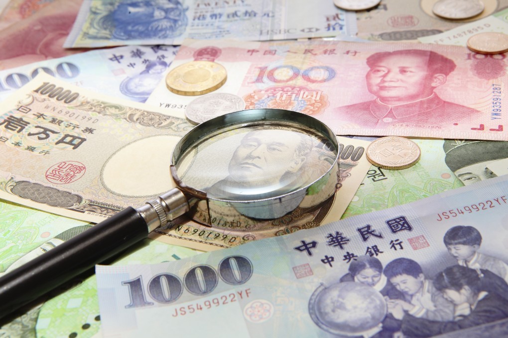 Asia's servicing of foreign currency debt becomes more expensive if the local currency falls in value. Photo: Getty Images