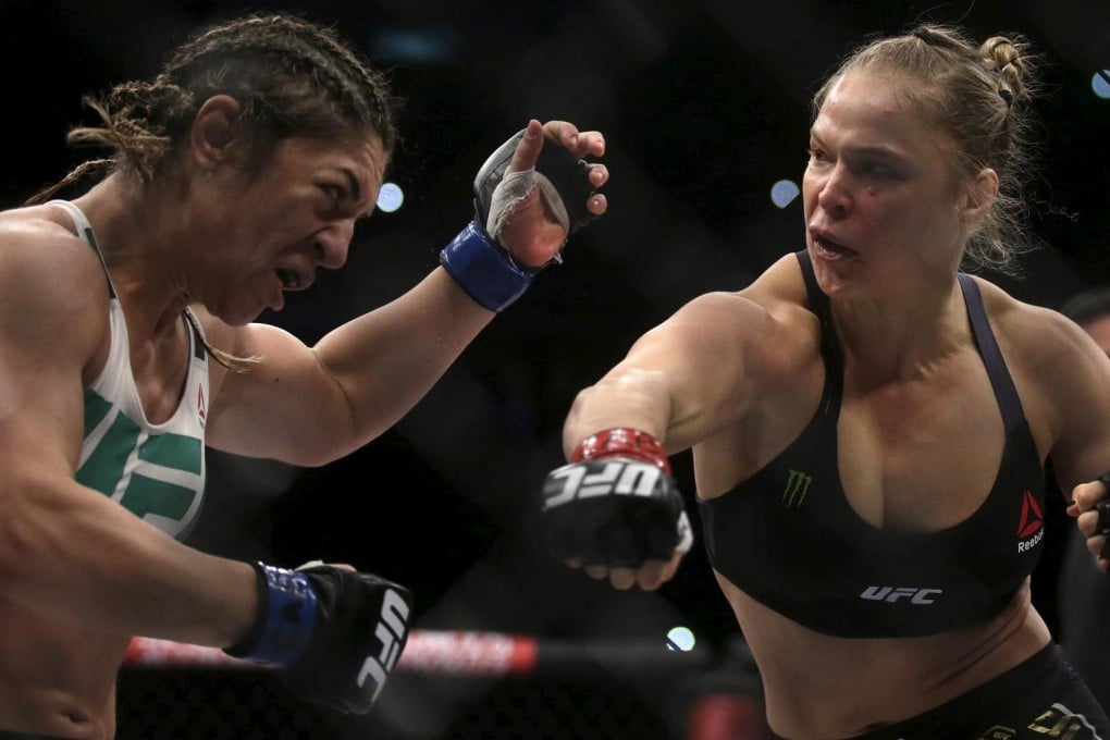 Ronda Rousey lands a punch on Brazil's Bethe Correia during her quick-fire victory in Rio de Janeiro. Photos: Reuters