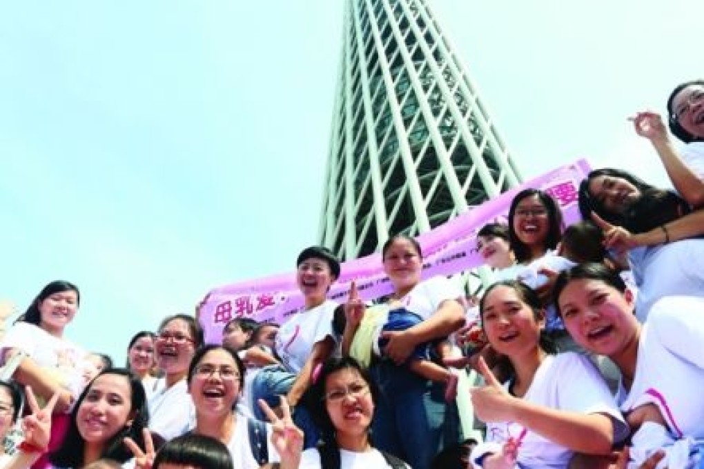 Several dozen mothers breastfeed outside the Canton Tower in Guangzhou in Guangdong province on Saturday. Photo: SCMP Pictures