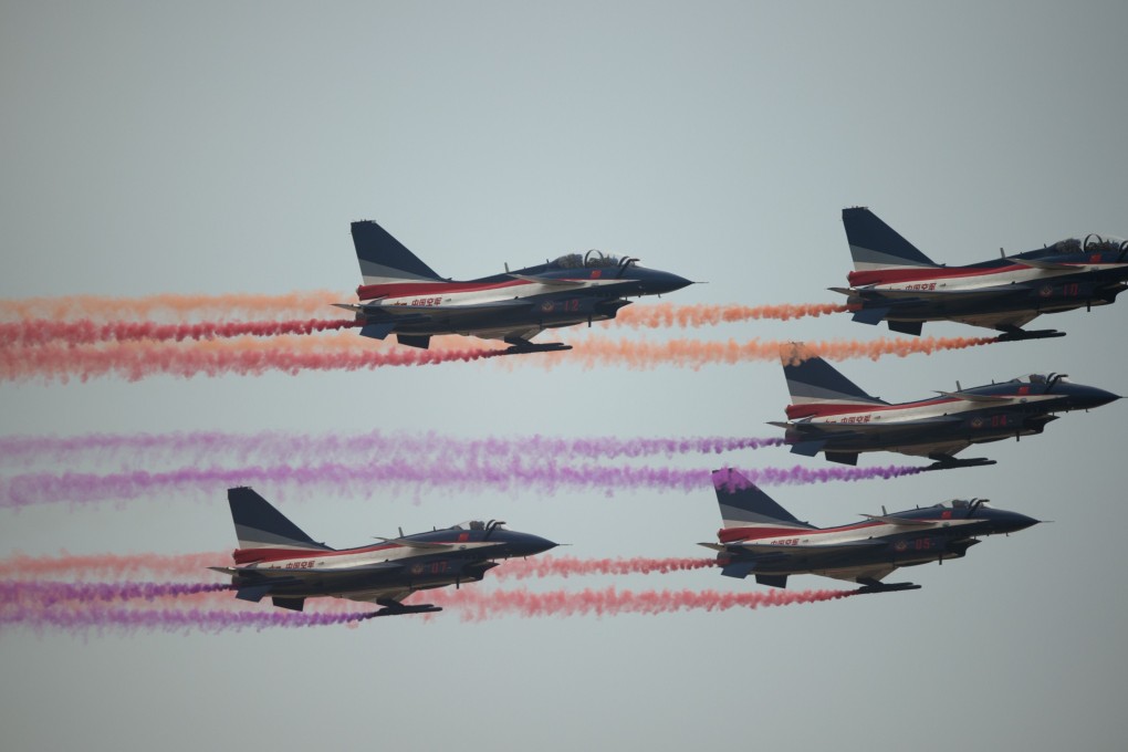 PLA fighters taking part in a display at the Zhuhai air show last year. The think tank report says China's military needs to develop new weaponry including an unmanned attack aircraft. Photo: AFP