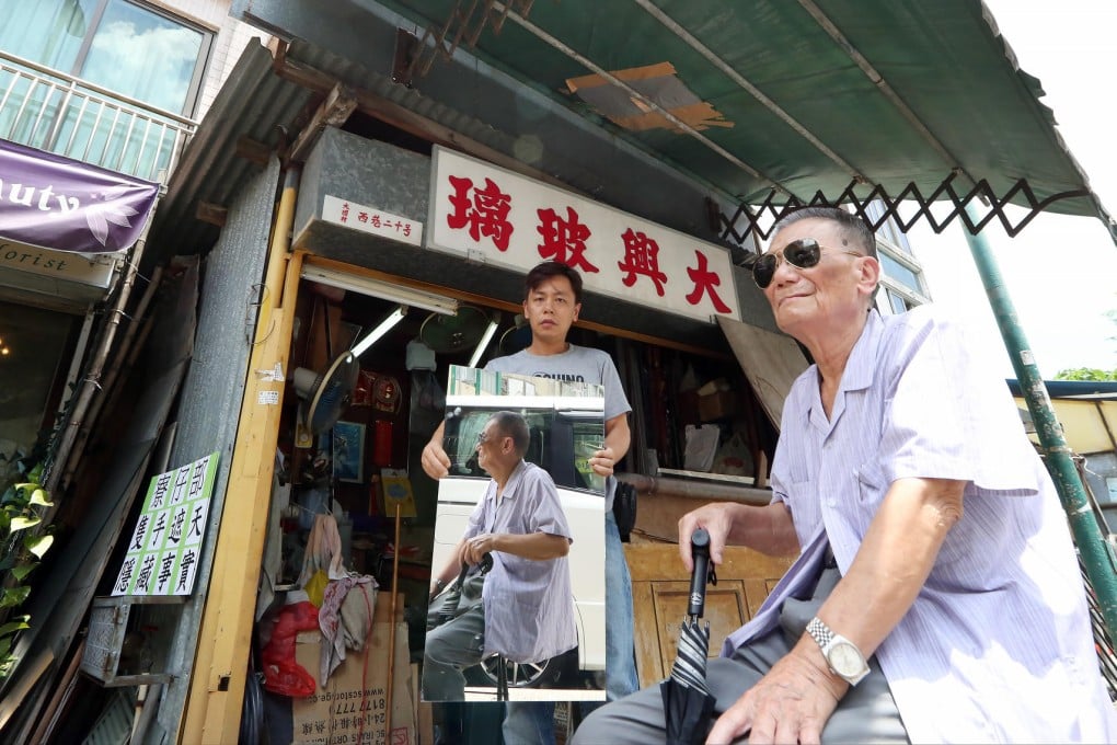 Lew Kay-nang (right) with his son Lew Kam-ming at the squatter's hut. Photo: Nora Tam