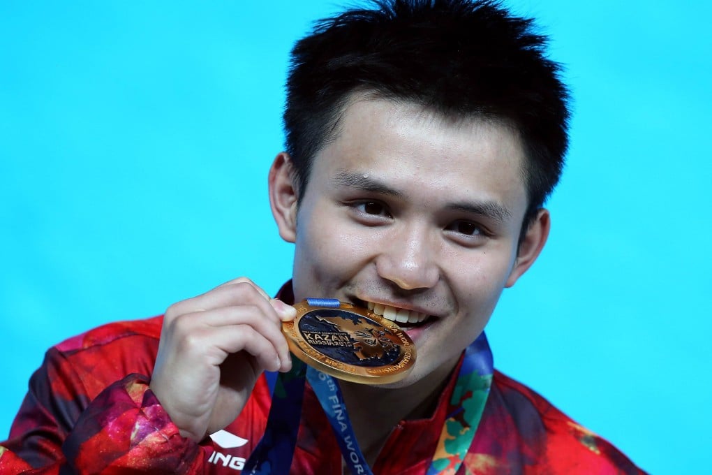 Qiu Bo with his latest gold. Photo: Reuters