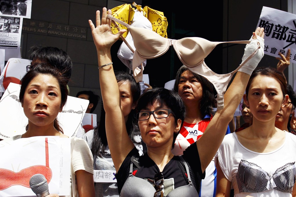 Protesters hold up bras during a demonstration in support of Hong Kong female protester Ng Lai-ying. Photo: Reuters