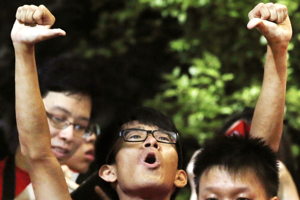 A Hong Kong fan boos before the Maldives game. Photo AP