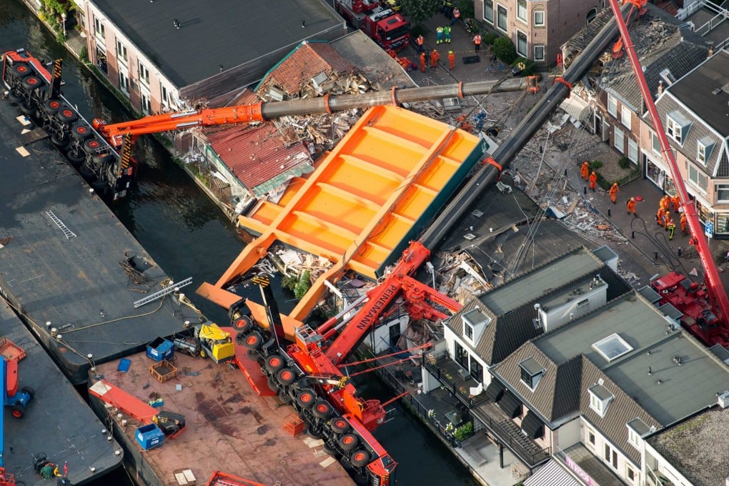 An aerial view of the area where two cranes fell onto a row of houses in Alphen aan den Rijn, the Netherlands. Photo: EPA