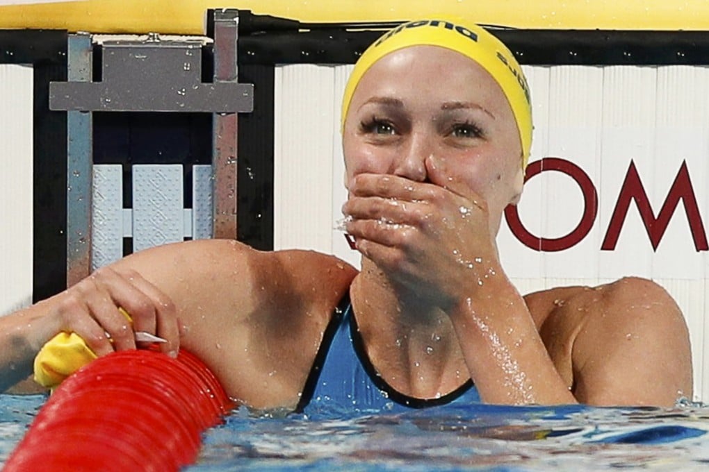 Sarah Sjostrom of Sweden reacts after setting a new world record in women's 100m butterfly final. Photo: Reuters
