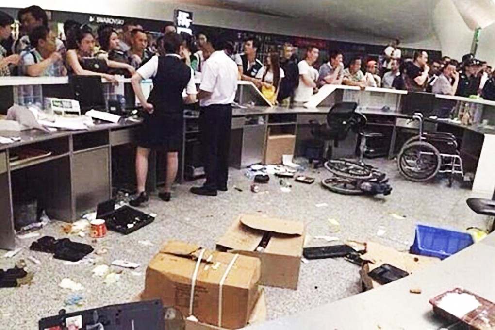 Irate passengers create a ruckus at the airport in May after their flight was delayed. Photo: SCMP Pictures