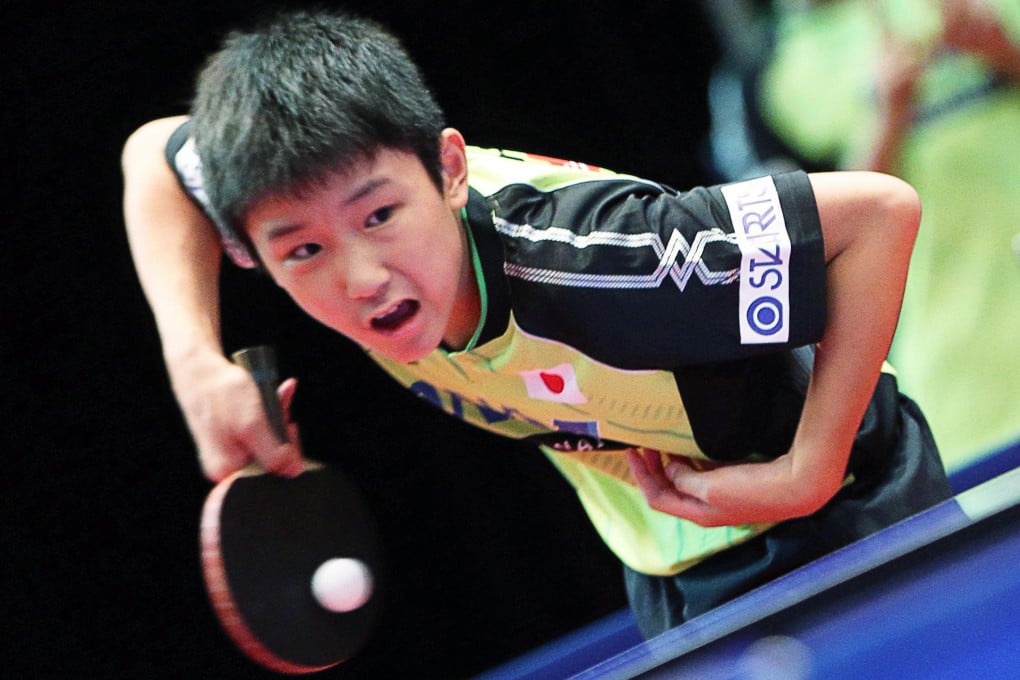 Japan's Tomokazu Harimoto competes at the Nikon Hong Kong Junior & Cadet Open at Queen Elizabeth Stadium where he notched two wins yesterday. Photo: K.Y. Cheng