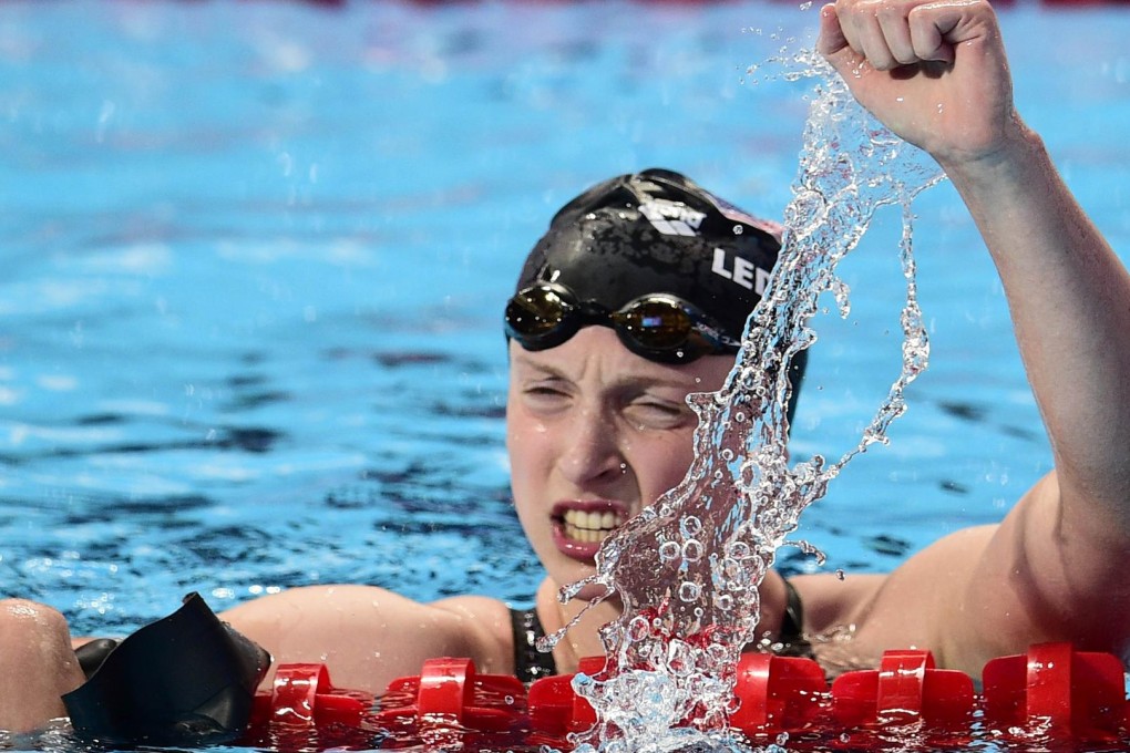 Katie Ledecky of the United States celebrates setting a world record in winning the final of the women's 1,500m freestyle at the world championships in Kazan. Photos: AFP