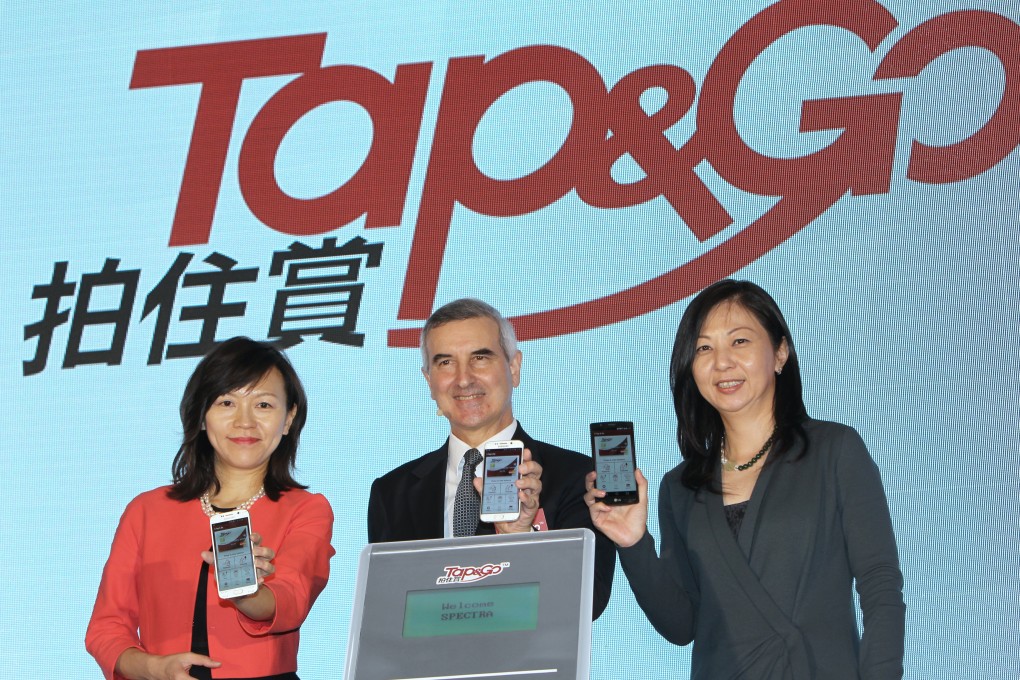 HKT Group managing director Alex Arena (centre) launched the 'Tap&Go' electronic transaction system in Hong Kong late last month. Photo: Franke Tsang