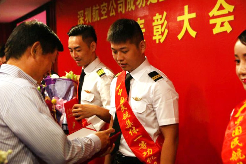 The Shenzhen Airlines crew are honoured for bravery on Wednesday. Photo: SCMP Pictures