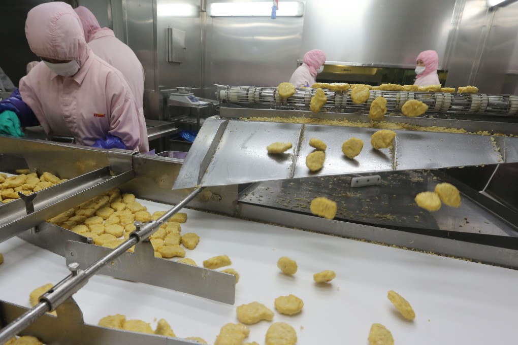 Workers producing food at a factory in Shanghai. Photo: AFP