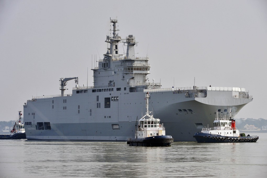 This file photo taken in March off Saint-Nazaire, northwestern France, shows a  Mistral-class warship on its way for its first sea trials. The deal to sell the ship and a sister vessel to Russia has fallen through. Photo: AFP