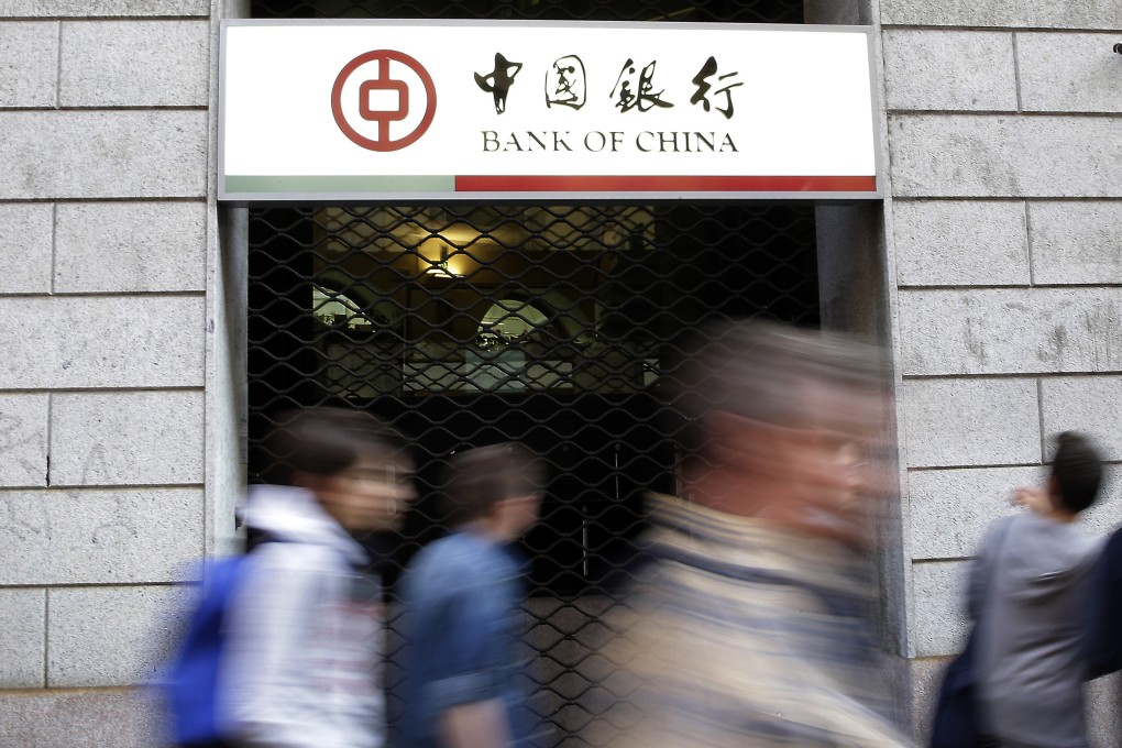 Residents walk past the Bank of China branch in downtown Milan, Italy. The branch is accused of allowing billions of euros to be smuggled out of Italy through its accounts. Photo: AP