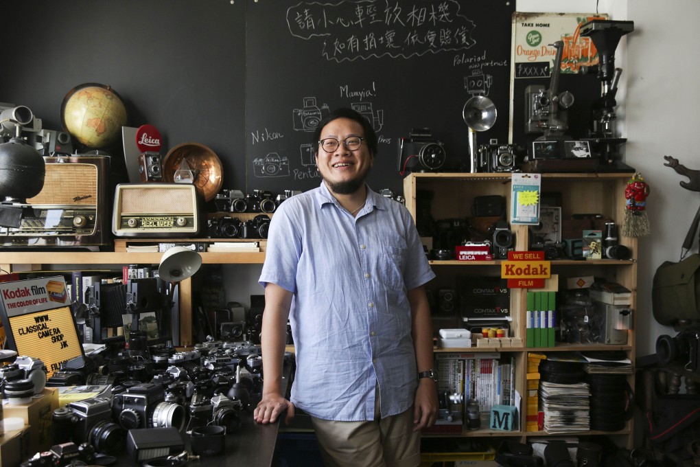 Lai Chun-fai in his vintage store in Prince Edward. I wanted to display older cameras that not many others have seen in Hong Kong,” said Lai, who first started selling old Leica models.  Photos: AFP