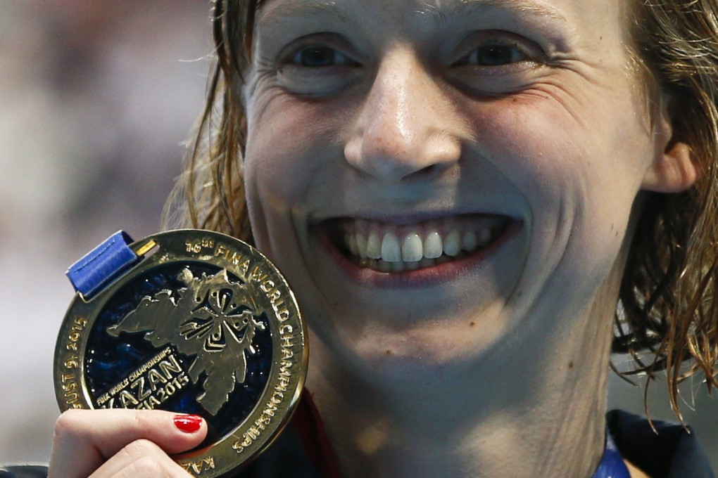 Katie Ledecky is all smiles after receiving her gold medal after the women's 200m freestyle final. Photo: Reuters