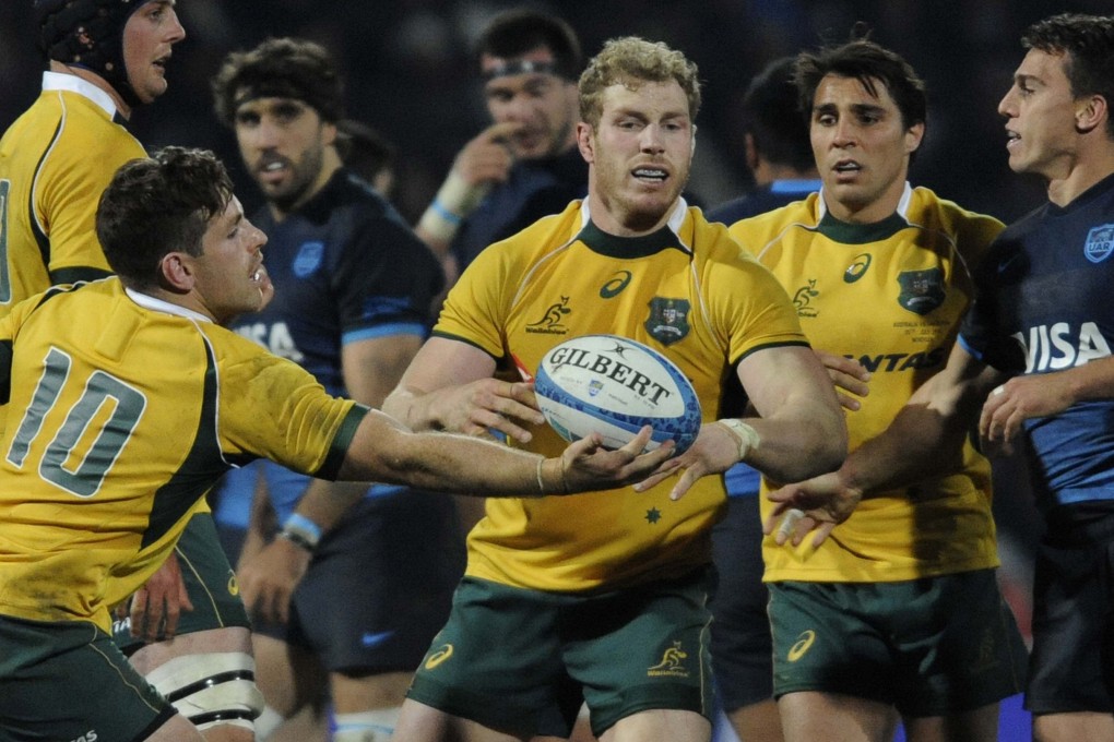 David Pocock (centre) will be at the back of the scrum for Australia on Saturday. Photos: AFP