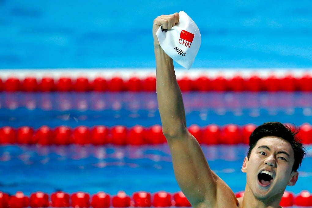 Ning Zetao celebrates winning the 100m freestyle final. Photo: Reuters