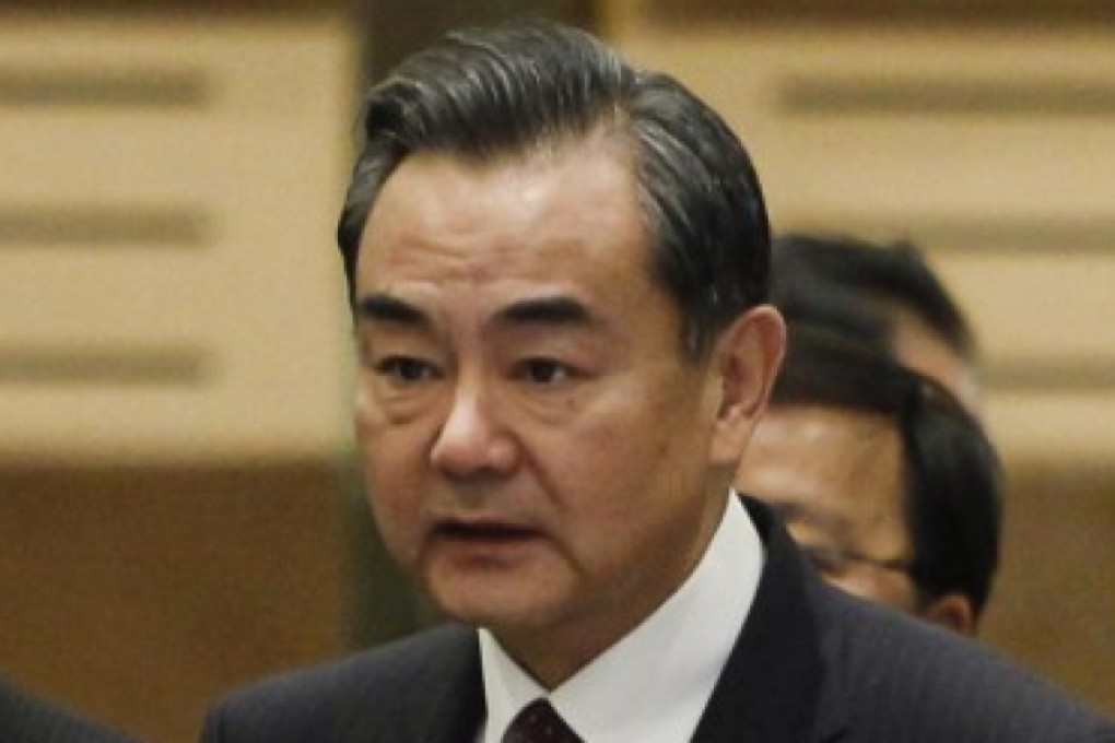 Foreign Minister Wang Yi tells the East Asia Summit on Thursday that Beijing was not impeding freedom of navigation in the contested waterway. Photo: AP