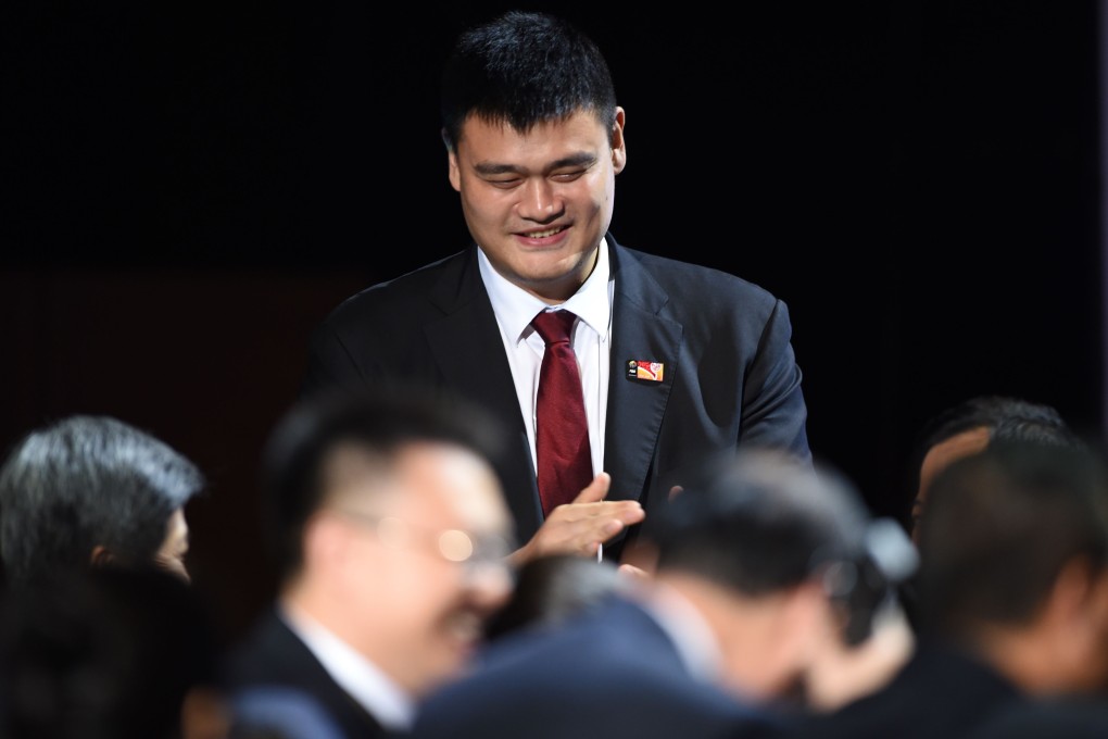 Members of the Chinese delegation including basketball legend Yao Ming celebrate after China was selected to host the 2019 FIBA Basketball World Cup in Tokyo on Friday. Photo: AP