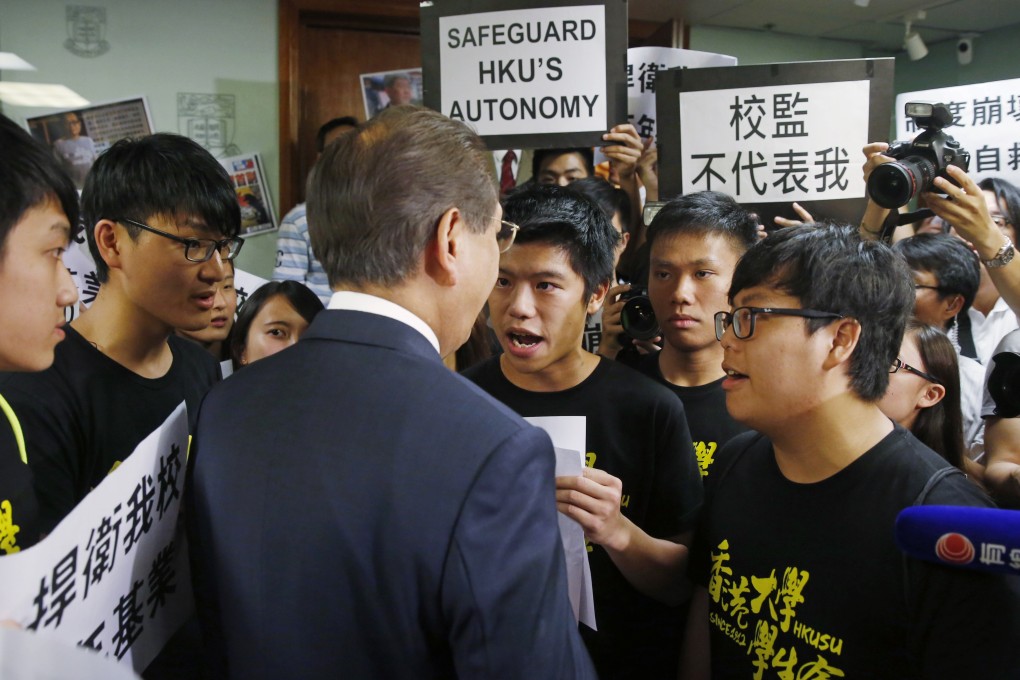 Students invaded the council meeting after members voted down a motion to stop delaying the pro-vice-chancellor appointment last month. Photo: AP