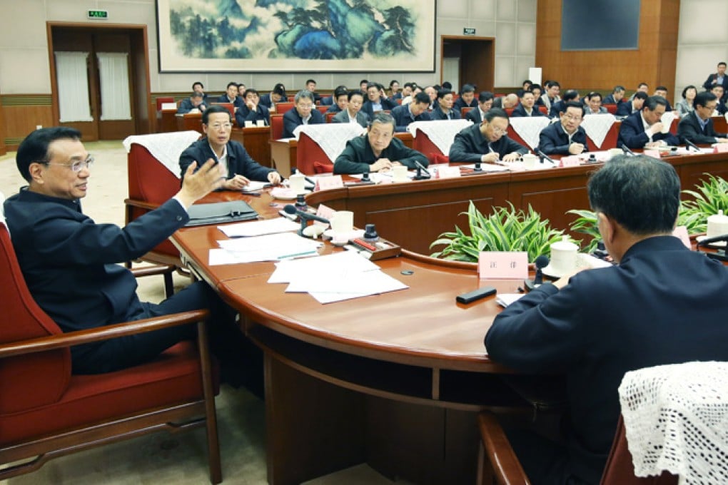 Chinese Premier Li Keqiang (left) presides over a symposium attended by multiple ministries and key state-owned enterprises in Beijing in April this year. The Communist Party first outlined plans for the SOE overhaul two years ago. Photo: Xinhua