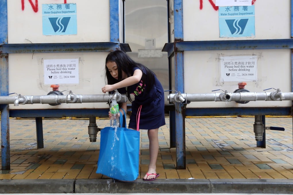 Residents collect fresh water at one of the temporary distribution points at Hung Hom Estate in Hung Hom, amid lead water scare. Photo: Sam Tsang