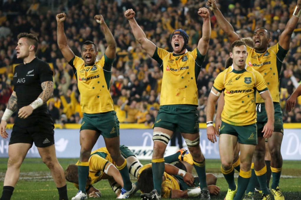 Australia celebrate beating New Zealand in Sydney on Saturday to capture the 2015 Rugby Championship and take the first of their two Bledisloe Cup games. Photo: Reuters