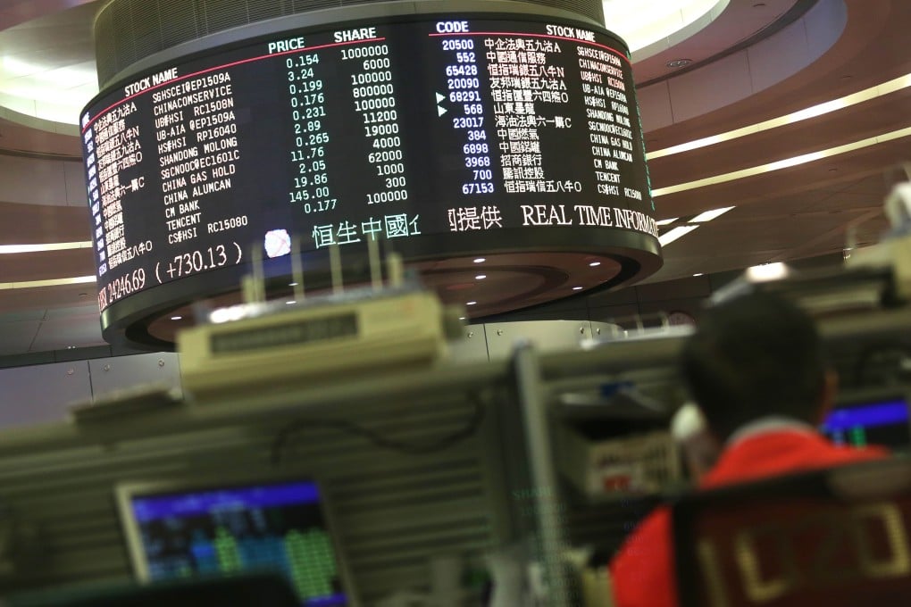 A trader works at the Hong Kong stock exchange as Boer hit back at reports accusing it of inflating its profits. Photo: AFP