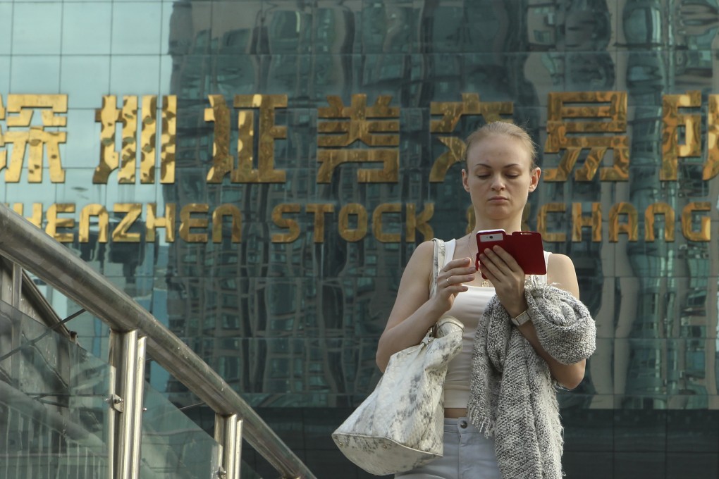 A woman walks away from the Shenzhen stock exchange as markets in mainland China and Hong Kong may continue to see downside risks in the days ahead. Photo: ImagineChina