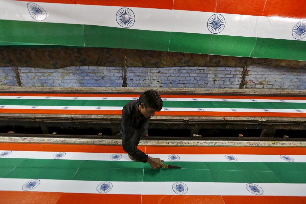 Indian national flags are being made ahead of the country's independence day on August 15. Industrialisation has great potential in India. Photo: Reuters