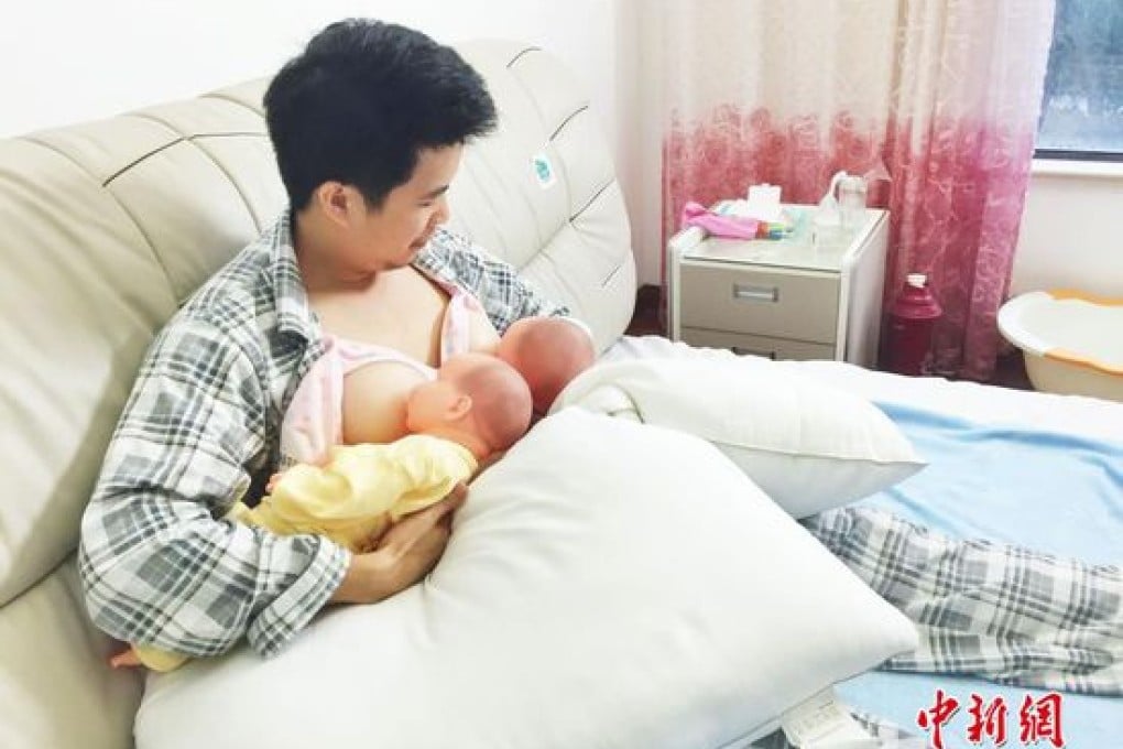 One of the volunteers simulates feeding a baby doll using plastic breasts. Photo: China News Service