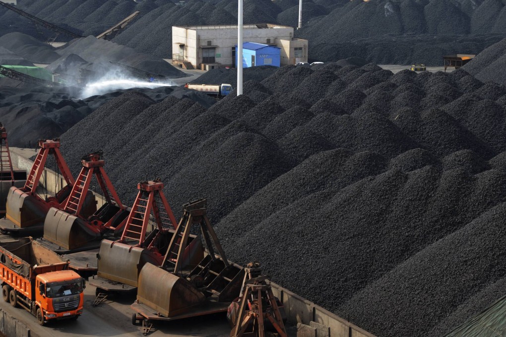 Trucks haul mountains of coal in China as imports of the material surged in July although most in the trade doubt it can be sustained. Photo: Reuters