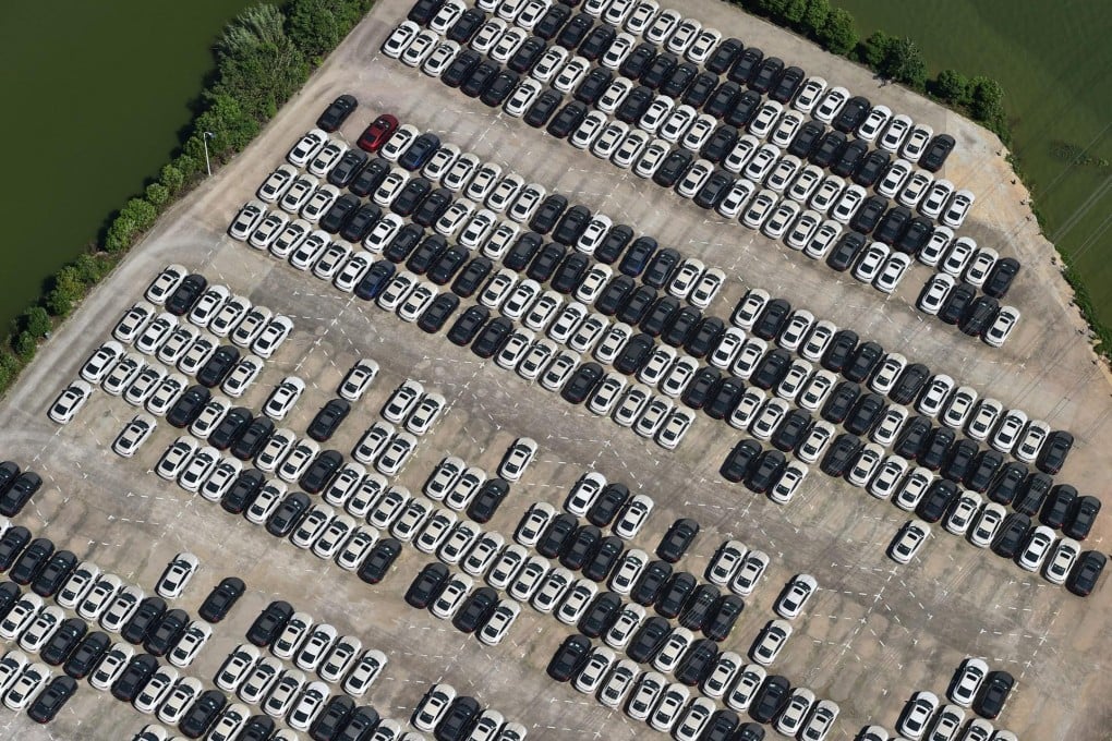 New cars almost fill a car park in Wuhan, Hubei province. Some dealers are being asked to continue to meet sales targets. Photo: EPA