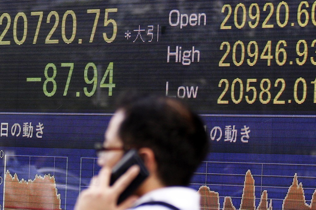 Global stocks and Asian currencies fell after China unexpectedly devalued its yuan in response to weakening trade and growth. Photo: AP
