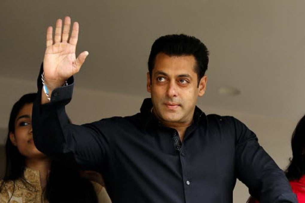 Indian Bollywood actor Salman Khan waving to fans at his residence in Mumbai. Photo: AFP