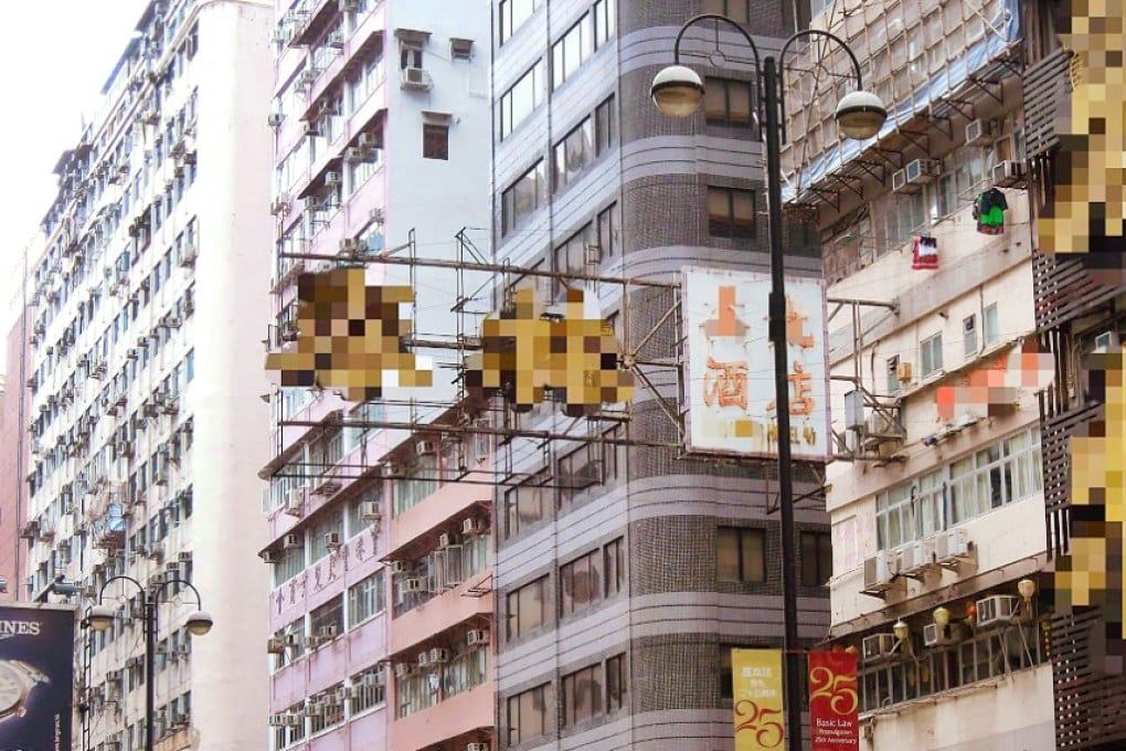 A new signboard on Nathan Road placed on an old rusty shelf which was used by a defunct company. Names have been pixellated. Photo: DAB