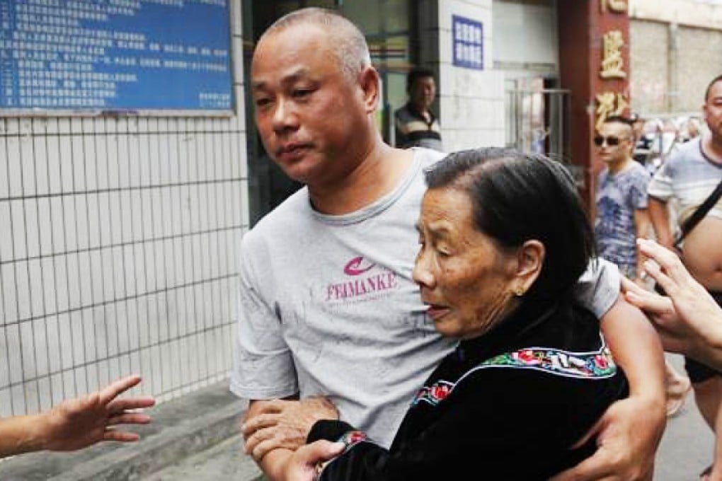 Yang Ming hugs his mother after leaving jail. Photo: SCMP Pictures