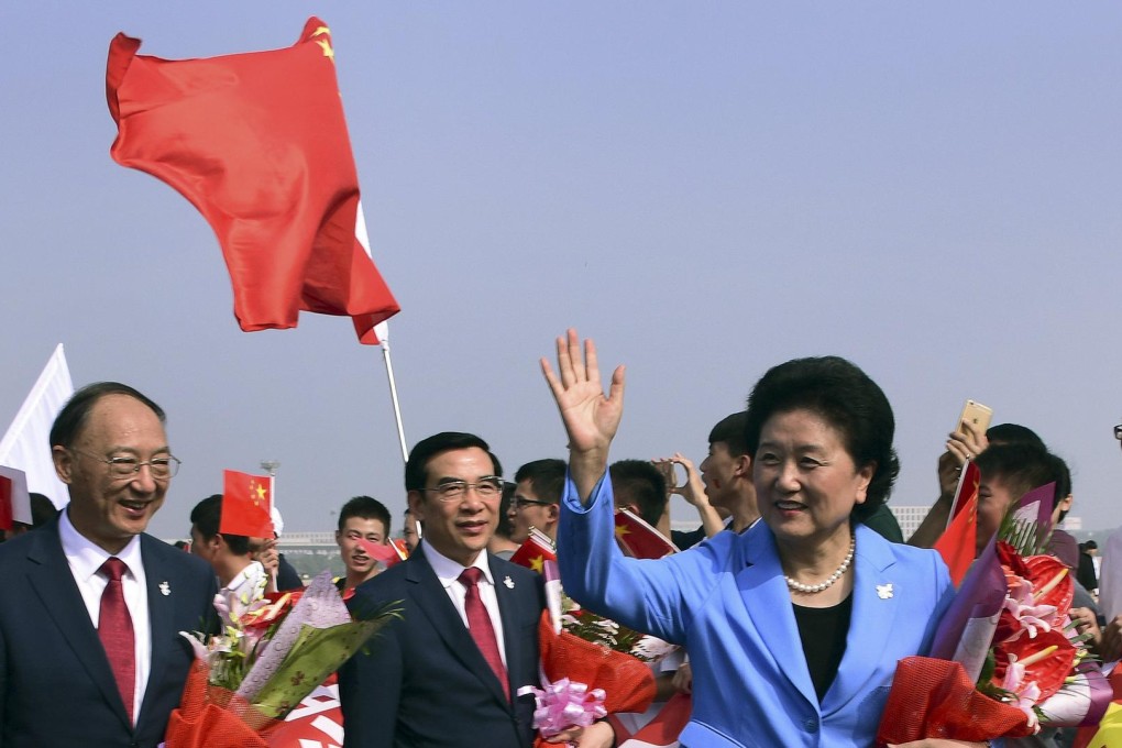 China's Beijing 2022 delegation is welcomed on their return. Photo: Reuters
