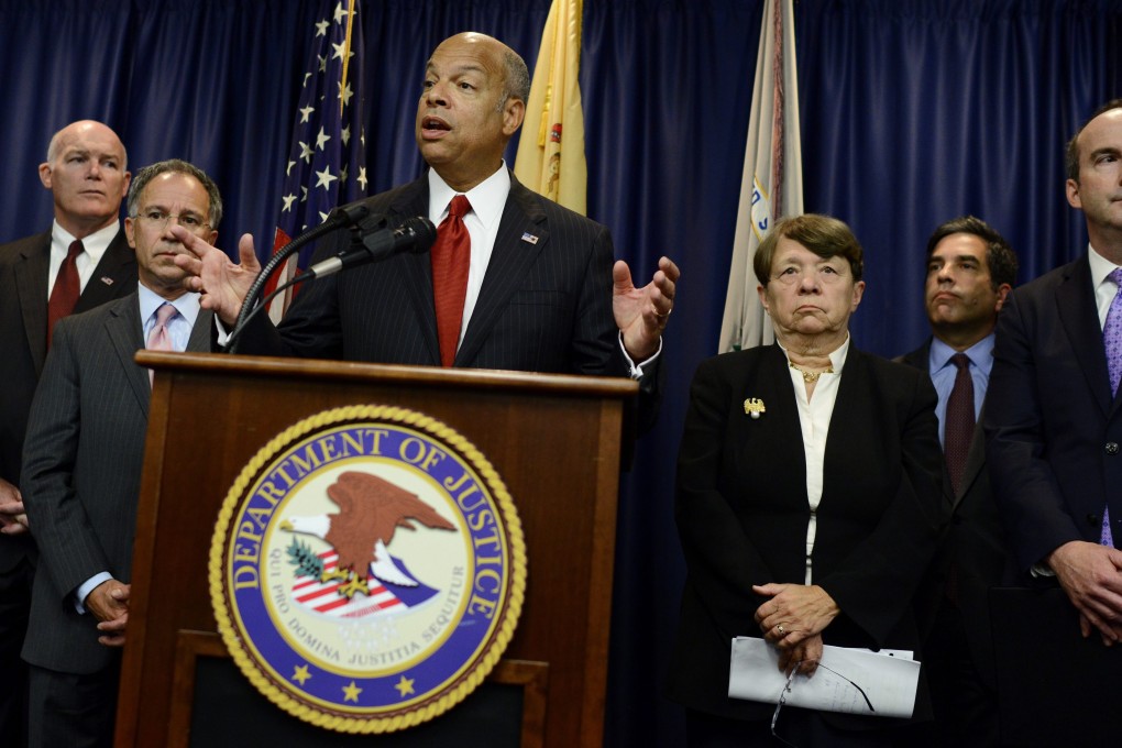 US Homeland Security Secretary Jeh Johnson announces details of the insider trading case in Newark, New Jersey, on Tuesday. Photo: EPA