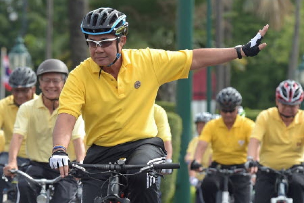 Thai Prime Minister Prayut Chan-O-cha pictured on a bike in July. He has defended a plan to appoint his brother as head of the army. Photo: AFP