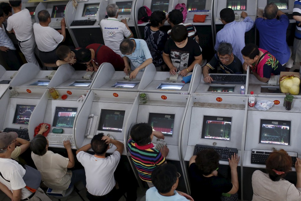 Investors pour over their stock choices as China's devaluation of the yuan forced investors to struggle who will benefit from the move. Photo: Reuters