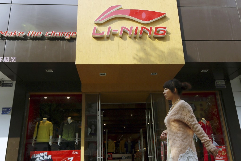 A woman walks past a Li Ning sportswear store in Huaibei, Anhui province in China. Photo: Reuters
