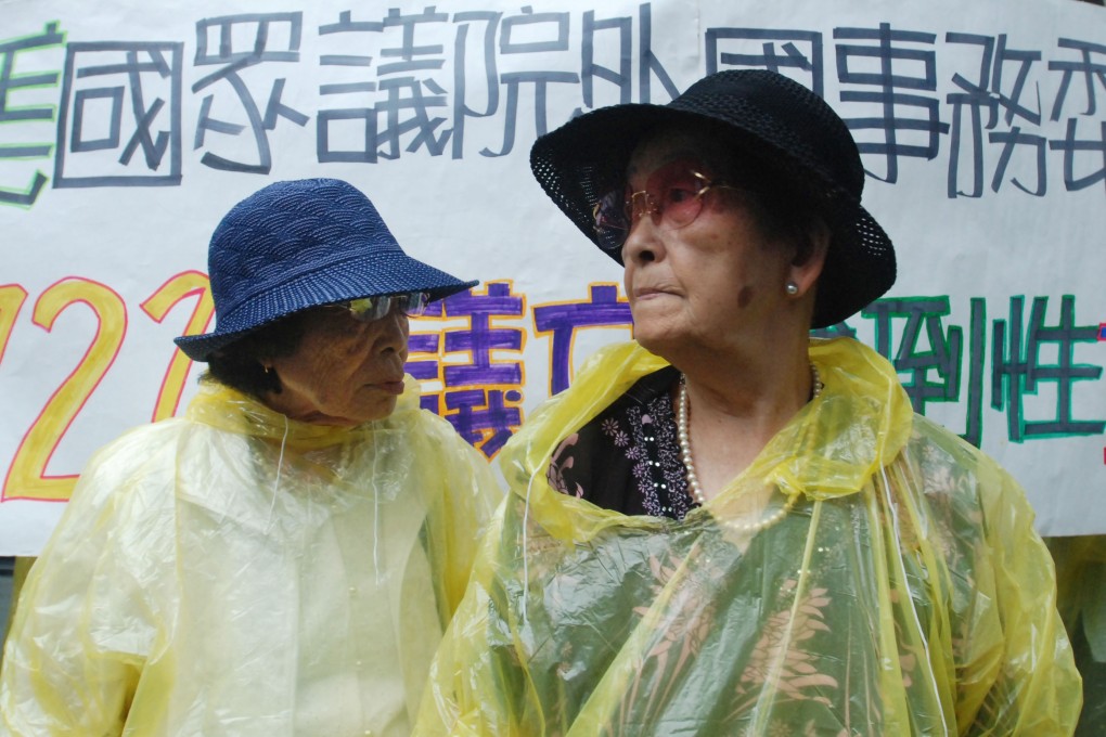 Former Taiwanese "comfort women" Chen Tao, 86, left, and Chen Yang, 86, protest outside Japan's representative in Taipei on Friday. The women want an apology and compensation from Japan. Photo: AP