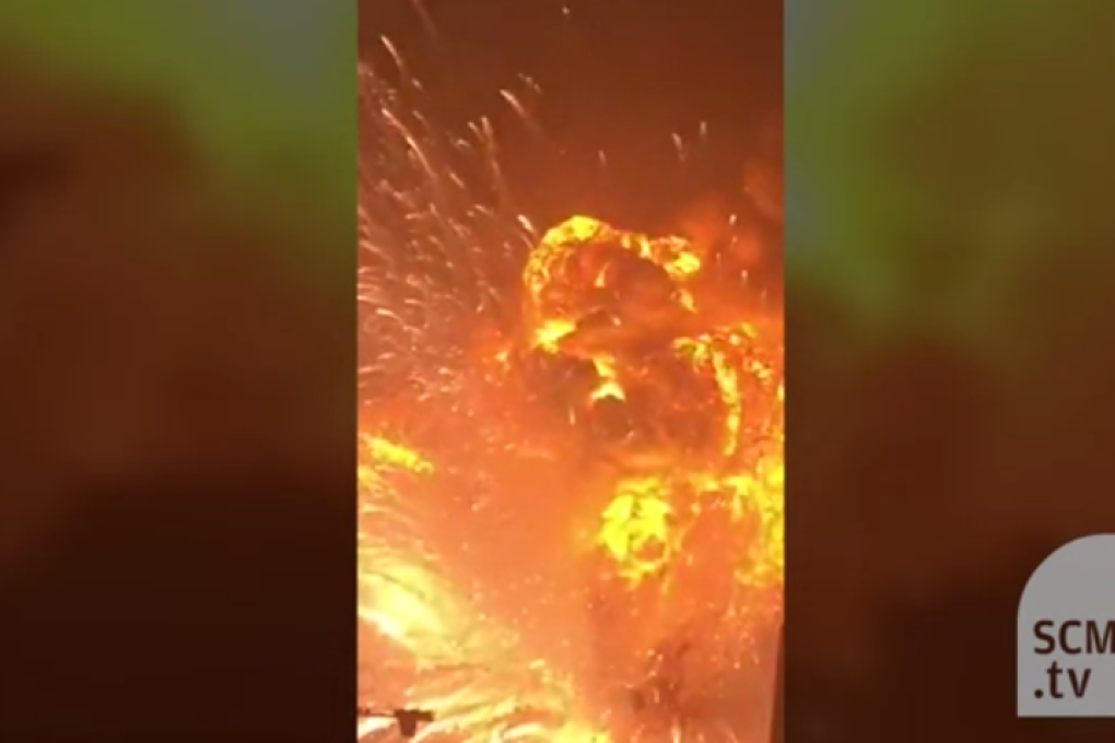 Face to face with a fireball: Tianjin resident captures terrifying moment warehouse is blown to smithereens