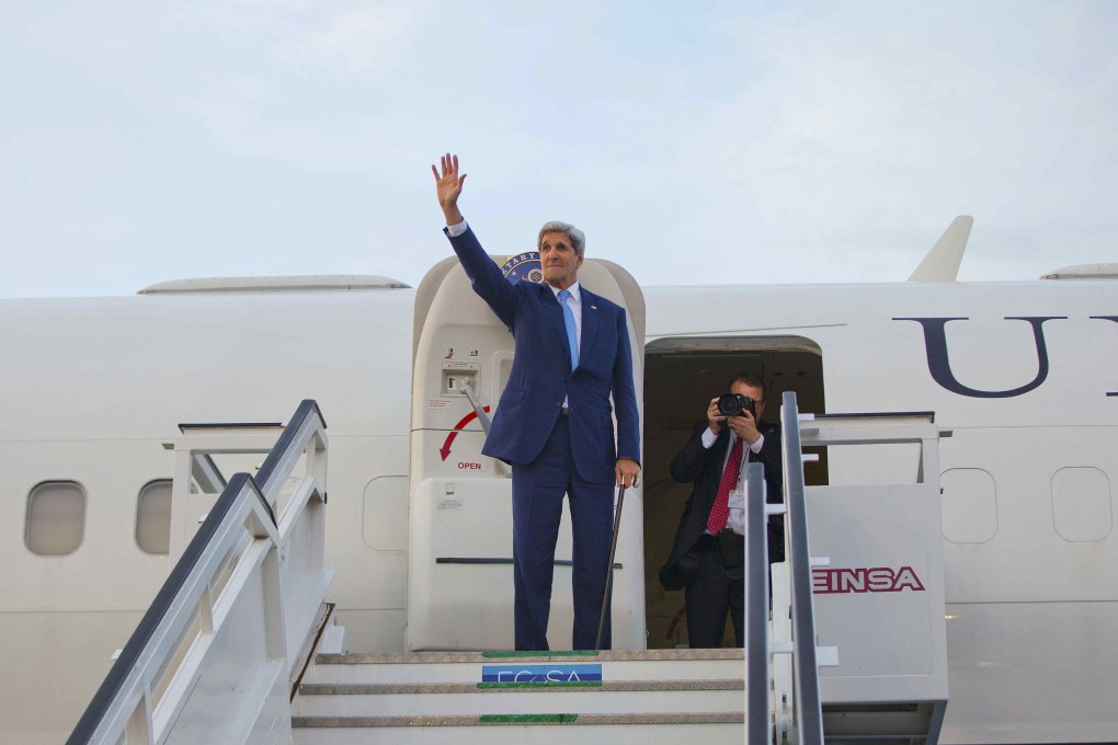 US Secretary of State John Kerry waves from the top of the stairs before boarding his aircraft for his departure at Jose Marti International Airport in Havana. Photo: Reuters