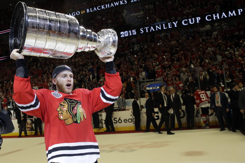 Patrick Kane lifts the Stanley Cup after helping the Chicago Blackhawks to victory against the Tampa Bay Lightning. Photos: AP