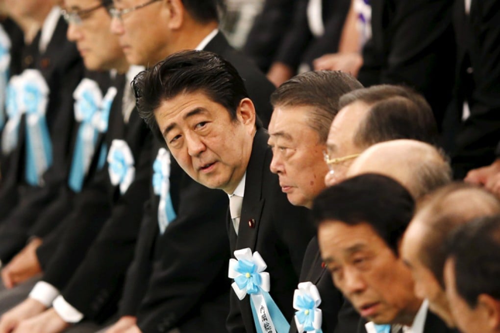 Japan's Prime Minister Shinzo Abe (cente) attends a memorial service ceremony at at Budokan Hall in Tokyo, marking the 70th anniversary of Japan's surrender in the second world war. Photo: Reuters