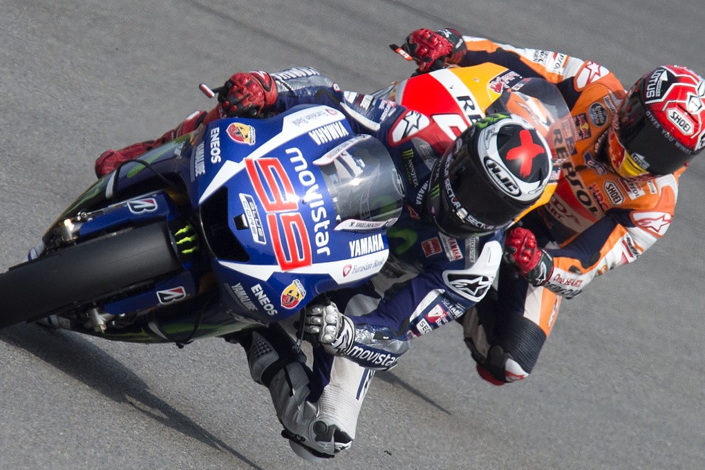 Yamaha MotoGP's Spanish rider Jorge Lorenzo keeps in front of Repsol Honda Team's Spanish rider Marc Marquez during the Czech MotoGP. Photo: AFP