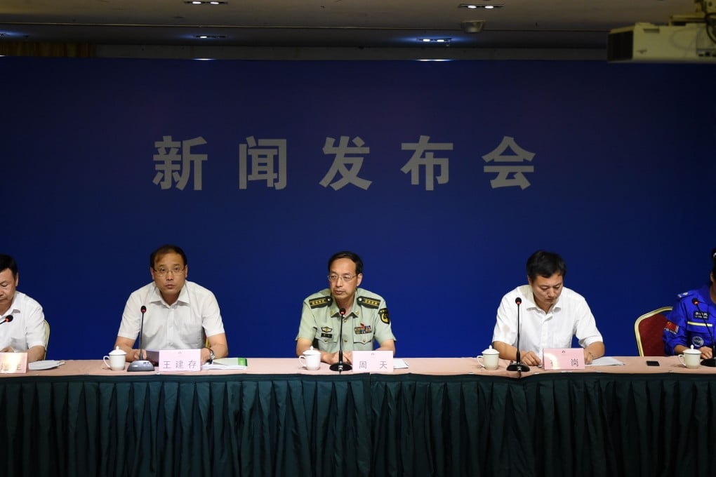 Head of Tianjin Health and Family Planning Commission Wang Jiancun (2nd from left) speaks at the fifth press conference on the warehouse explosion in Tianjin. Photo: Xinhua